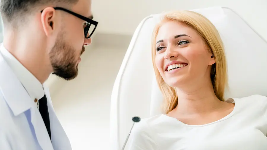 female patient talking to a Foothills dentist